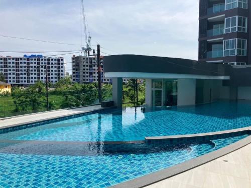 a large swimming pool on the roof of a building at Luxury Condo The City Phuket in Heart of Phuket in Kathu