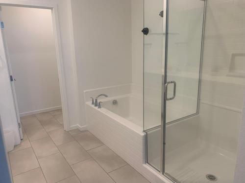 a bathroom with a shower with a glass door at Walking on water street in Las Vegas