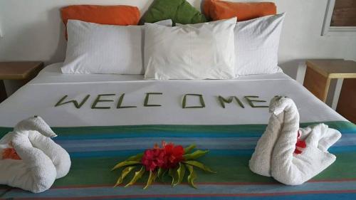 Katil atau katil-katil dalam bilik di Daku Resort