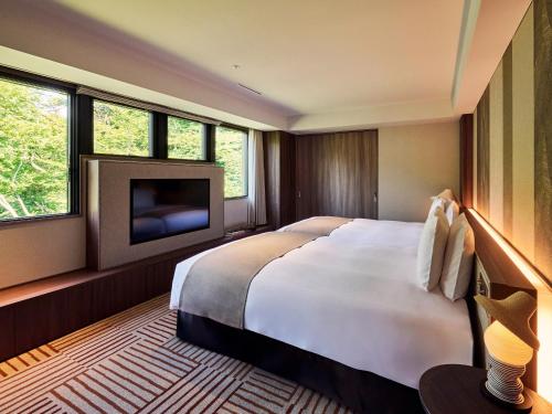 Voodi või voodid majutusasutuse Glamday Style Hotel & Resort Kyu-Karuizawa toas