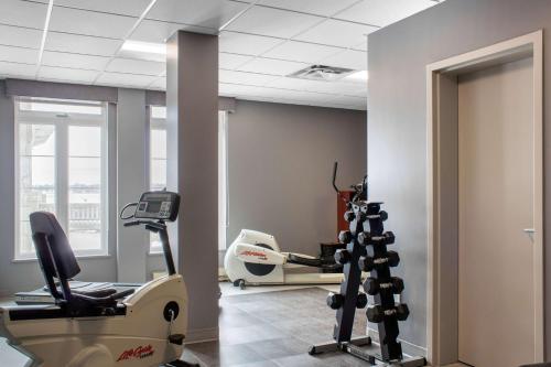 a room with a gym with a treadmill at Chateau Moncton Trademark Collection by Wyndham in Moncton