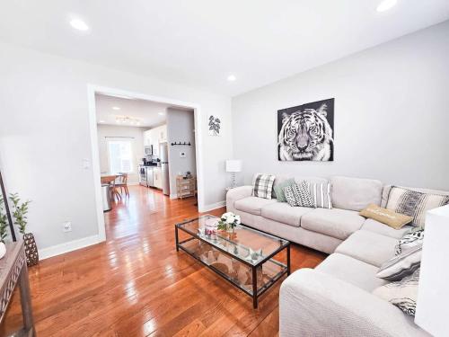 a living room with a couch and a table at 4 Minutes to UNC - 7 Minutes to Carrboro - En-Suite Bathrooms in Chapel Hill