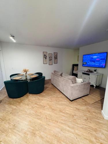 a living room with a couch and a table at The Hollywood loft FREE Parking in Los Angeles
