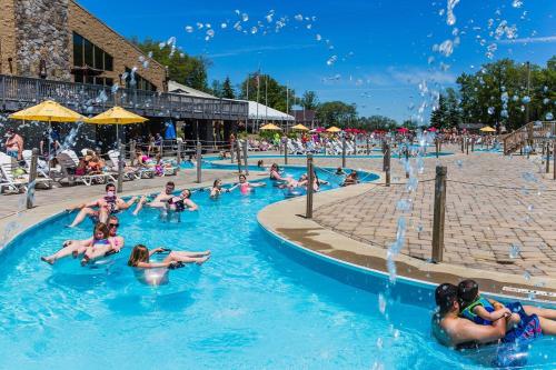 a group of people in the water at a water park at NEW " Fall Season " cozy 2 bed flat with open concept in Scranton