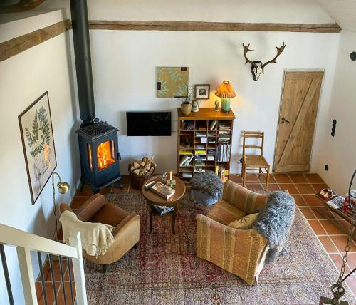 Μια τηλεόραση ή/και κέντρο ψυχαγωγίας στο Rural Guest Apartment In Grevlunda Hills