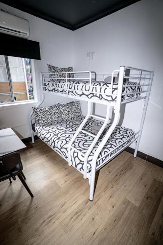 a couple of bunk beds in a room at Brisbane Quarters in Brisbane