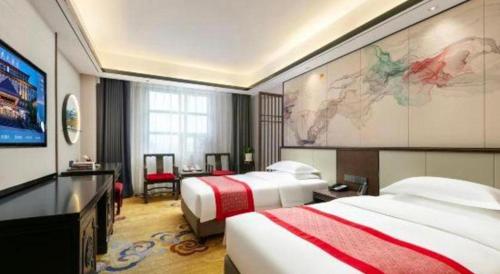 Postel nebo postele na pokoji v ubytování Dengfeng Chanwu Hotel