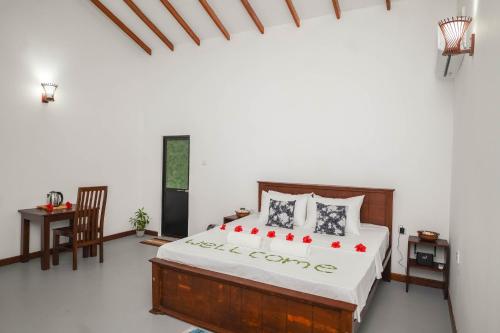 Postel nebo postele na pokoji v ubytování Fruit Garden Resort Sigiriya