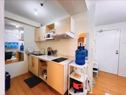 a small kitchen with a sink and a counter at Condo in Davao City Near Airport (Seamaster Staycation II) in Davao City