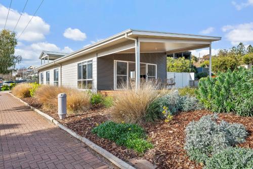 a house with a garden in front of it at The Shack at Maslin Beach - C21 SouthCoast Holidays in Maslin Beach