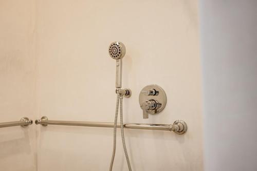 a shower with a blow dryer in a bathroom at Casa De La Vina - Boutique Suites in Downtown Santa Barbara in Santa Barbara