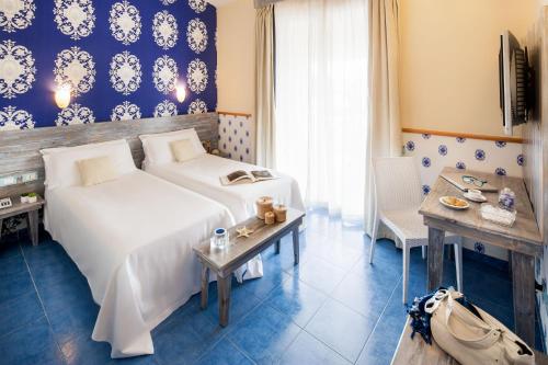Gulta vai gultas numurā naktsmītnē Ostia Antica Park Hotel & Spa
