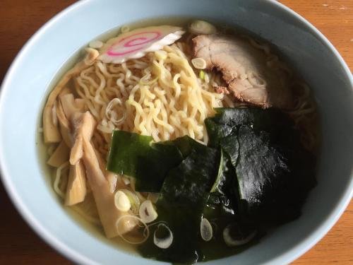 a bowl of soup with noodles and meat at kinugawaonsen Fukumatsu in Nikko