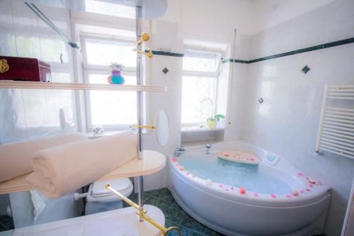 a bathroom with a tub with a toy in it at Bari Grand Central Apartment in Bari