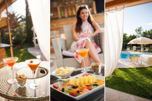 a woman sitting on a patio with a tray of food and drinks at Ostia Antica Park Hotel & Spa in Ostia Antica