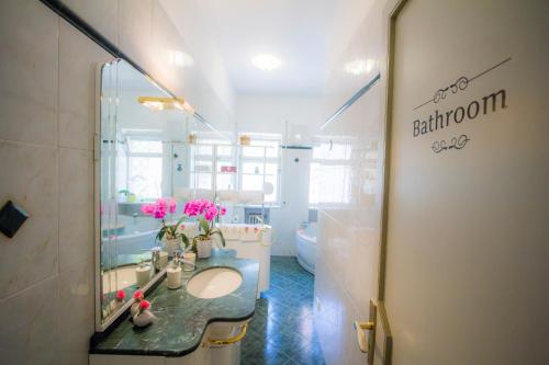 a bathroom with a sink and a mirror at Bari Grand Central Apartment in Bari
