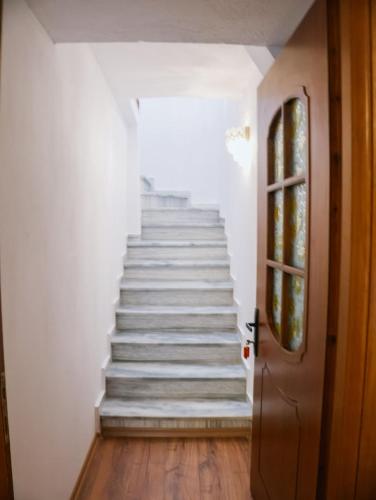 a stairway leading up to a stair case at Villa Marie 23 in Gjirokastër