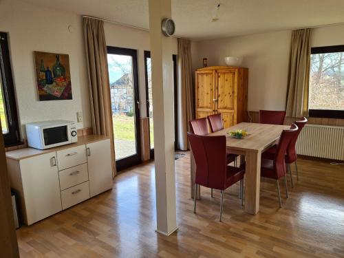 a kitchen and dining room with a table and chairs at Wohnung in Frankenau nahe Skipisten in Frankenau