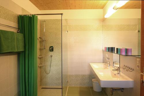 a bathroom with a shower and a sink and a shower at Naturwirt in Leutasch