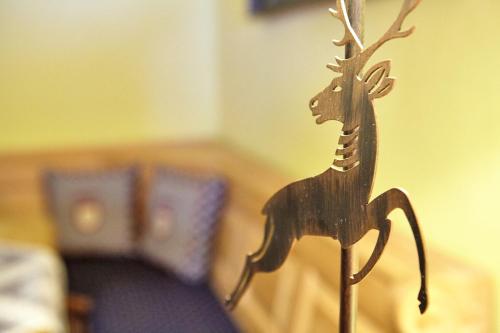 a wooden toy of a deer on a table at Olympiahaus in Garmisch-Partenkirchen