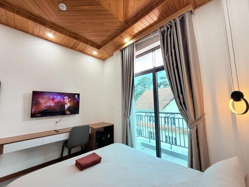 Postel nebo postele na pokoji v ubytování Hasa Đà Lạt Hotel