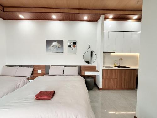 Postel nebo postele na pokoji v ubytování Hasa Đà Lạt Hotel