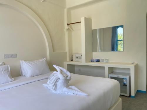 Cama o camas de una habitación en Endorphins Beach Villa
