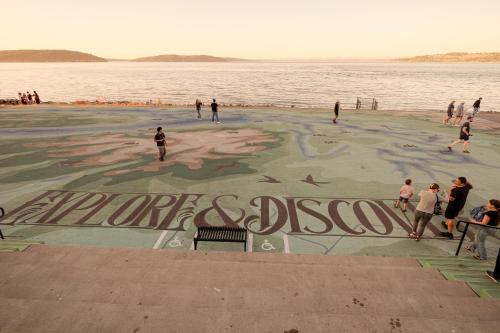 a group of people on a beach with the water at Bos Cozy Victorian Top Floor Duplex Unit with Puget Sound views in Tacoma
