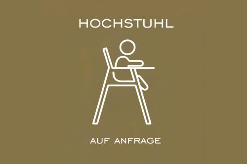 a man sitting at a table in an office outline icon at Familienferienwohnung HEIMat in Bludenz