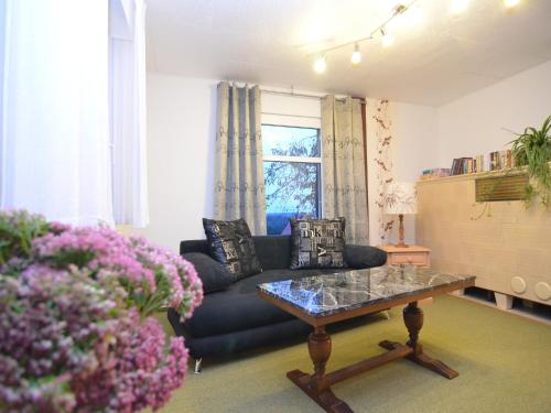 a living room with a couch and a table at Ferienhaus, Wernigerode in Wernigerode