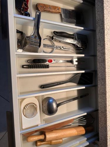 a refrigerator filled with lots of cooking utensils at Villa F5 vue sur mer 