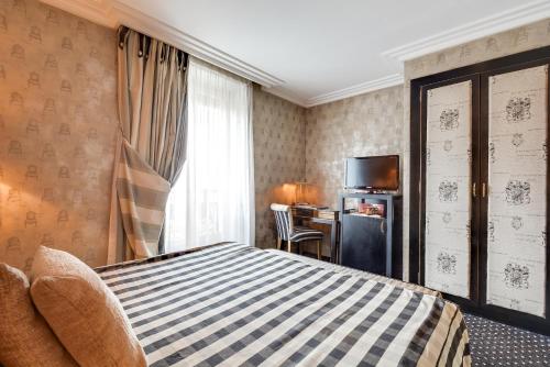 Una cama o camas en una habitación de Villa Lutèce Port Royal