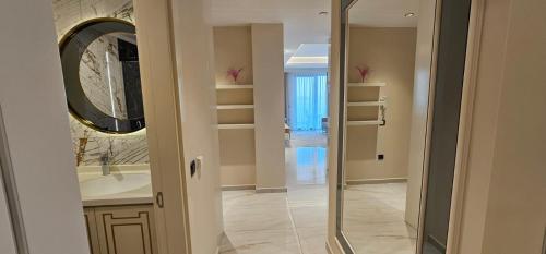 a bathroom with a sink and a mirror at The best Cebeci Towers 10 floor in Alanya