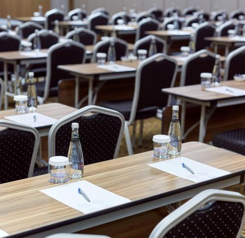 an empty dining room with tables and chairs at Novotel Konya in Konya