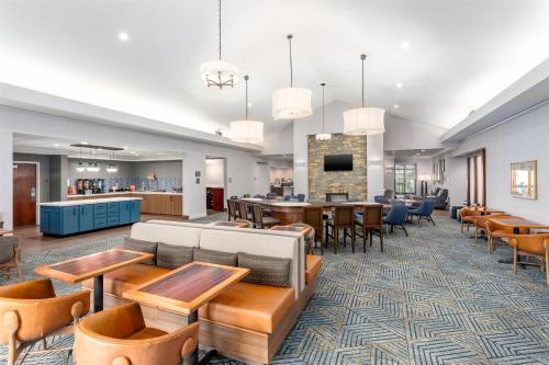 a lobby of a hospital with tables and chairs at Homewood Suites by Hilton Lexington Fayette Mall in Lexington