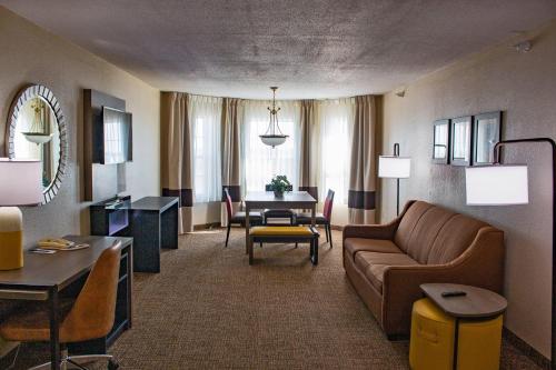 a living room with a couch and a table at Comfort Inn & Suites Geneva- West Chicago in Geneva