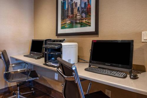 an office with two desks with a computer and a printer at Comfort Inn Romeoville - Bolingbrook in Romeoville
