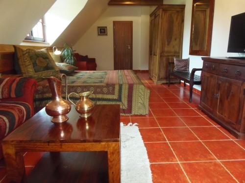 a living room with a couch and a table at Penzion Rozmarýn in Vsetín