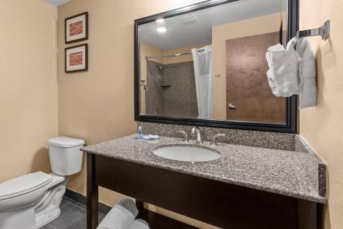 a bathroom with a sink and a toilet at Comfort Inn & Suites Beaverton - Portland West in Beaverton