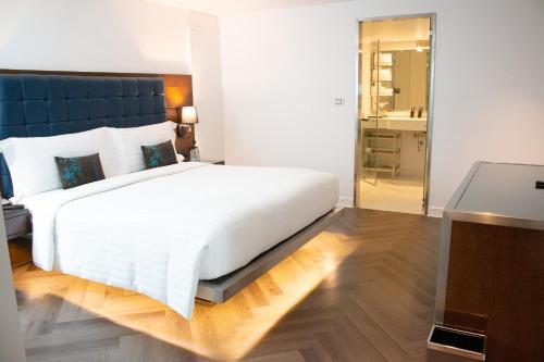 Letto o letti in una camera di Night Hotel Bangkok - Sukhumvit 15