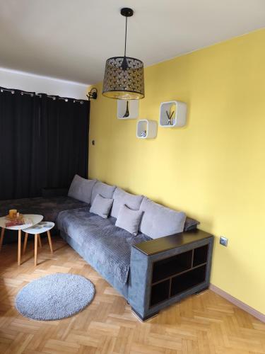 a living room with a couch and a table at Nadi in Plovdiv