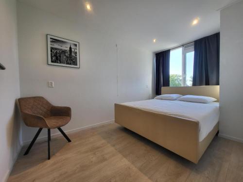 Ένα ή περισσότερα κρεβάτια σε δωμάτιο στο Residenz Polderblick