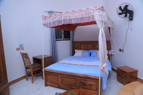 Postel nebo postele na pokoji v ubytování Ecohaven cottage