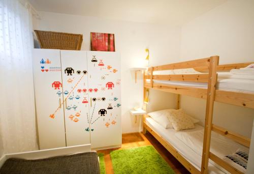 a bedroom with a bunk bed and a bunk bed at Adela Apartments in Dramalj