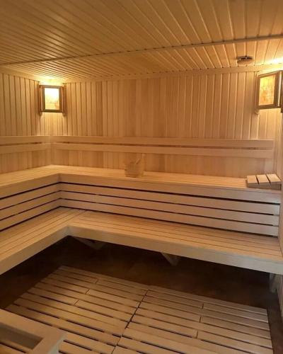 a wooden bench in a sauna in a room at New Alvina 44 in Tsaghkadzor