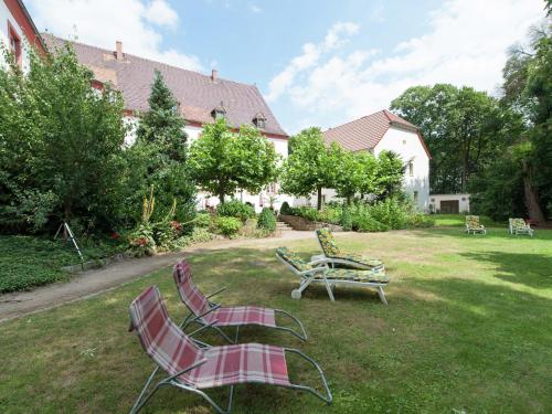 a group of lawn chairs sitting in a yard at Triestewitz Hideaway in Saxony in Arzberg