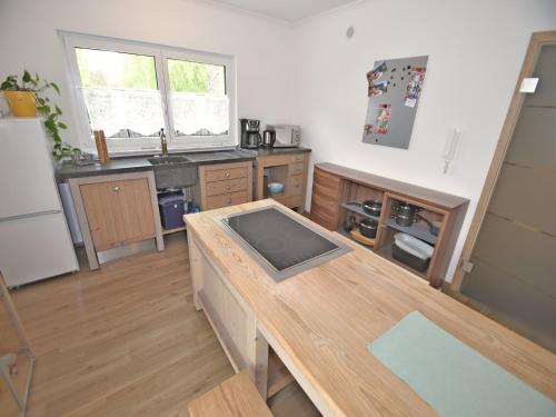 a kitchen with a wooden counter top in a room at Bodenwöhr Lakeside Gem in Bodenwöhr