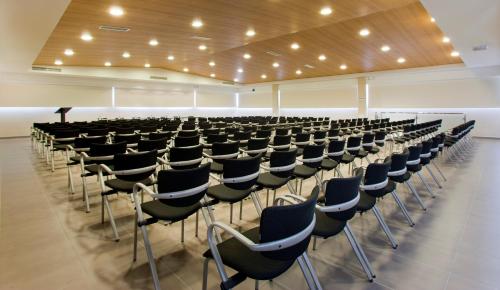 an empty lecture hall with chairs in a row at Hotel Playa Golf - Adults Only in Playa de Palma