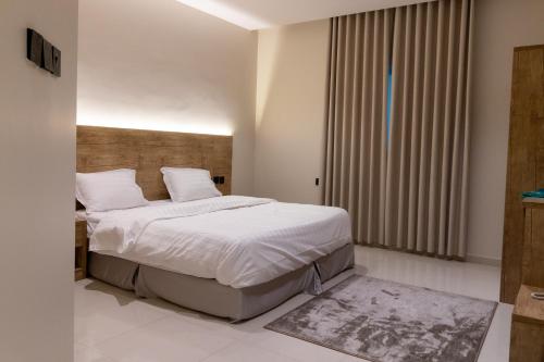 Postel nebo postele na pokoji v ubytování افاق الصفوة للشقق المخدومه afaq alsafwa serviced apartments