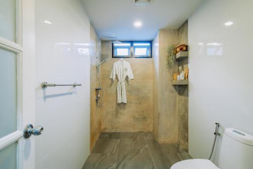 a bathroom with a shower and a toilet at Eden Villa A Tropical Paradise Pool Villa in Rawai Beach